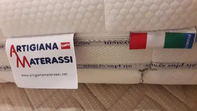 a close up of a mattress with a sign on it at L'Oasi al Pigneto - Guest house in Rome