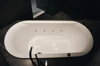 a white sink in a bathroom with a cord at LuMa Suite Via Veneto - Your luxury style 29 in Rome