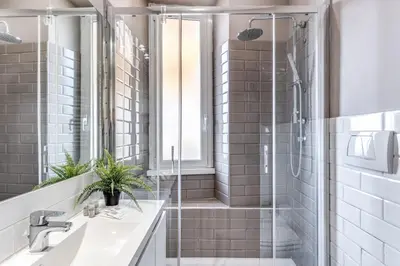a bathroom with a shower and a sink at Domus Heroas near Vatican in Rome