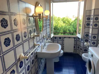 a bathroom with a sink and a mirror at Arion Holiday Home in Rome