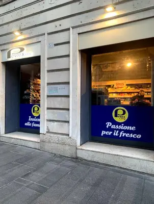 two windows of a store with signs on them at Arion Holiday Home in Rome
