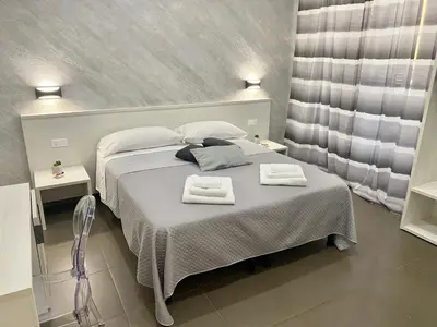a bedroom with a bed with two towels on it at Residenza Giustiniani in Rome