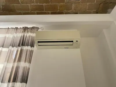 a air conditioner in a room with a curtain at Residenza Giustiniani in Rome