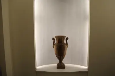 a vase sitting on a shelf in a wall at ColosseoDreamApartment in Rome