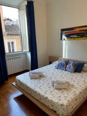 a bedroom with a bed with two towels on it at ColosseoDreamApartment in Rome