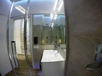 a bathroom with a sink and a mirror at Poliziano Apartment in Rome
