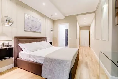 a bedroom with a large bed and a television at Mellini Palace Suites by Premium Suites Collection in Rome