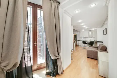 a living room with a couch and a window at Peroni 8 Pax Brand New Apartment in Rome