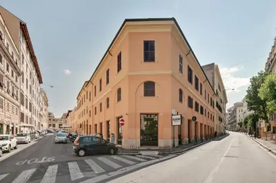 a building on a street with cars parked on the street at Peroni 8 Pax Brand New Apartment in Rome