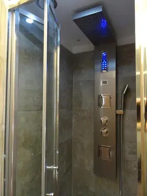 a shower with a glass door in a bathroom at Harmony & Comfort at the Vatican Museum in Rome