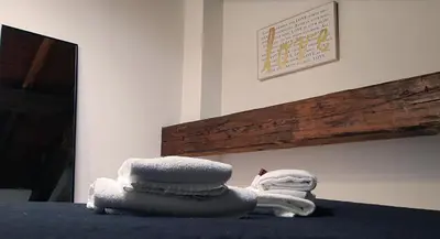 a stuffed elephant sitting on top of a bed at Ponte Milvio Luxury House in Rome
