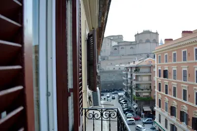 a view of a city street from a balcony at VaticanSky rooms in Rome