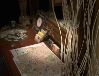 a table with a map and a clock on top of it at Saint Peter Inn in Rome