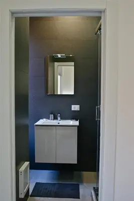 a bathroom with a sink and a mirror at Empire Suites in Rome