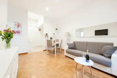 a living room with a couch and a table at White Flat Labicana in Rome
