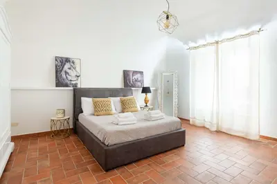 a bedroom with a large bed with two night stands at Navona 7 Suite in Rome