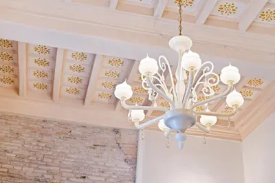 a chandelier hanging from the ceiling of a building at Pantheon Escape in Rome