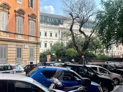 a bunch of cars parked in a parking lot at Ugo Foscolo in Rome
