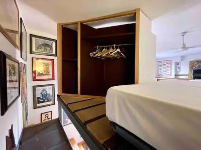 a bedroom with a bed and some pictures on the wall at Ugo Foscolo in Rome