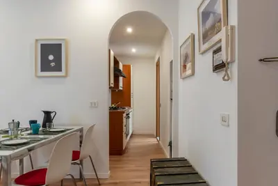 a kitchen and dining room with a table and chairs at Avignonesi 04 - FromHometoRome in Rome