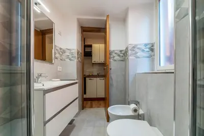 a small bathroom with a sink and a toilet at Avignonesi 04 - FromHometoRome in Rome