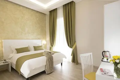 a bedroom with a white bed and a window at St. Peter Fortytwo in Rome
