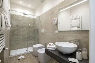a bathroom with a sink and a toilet and a shower at St. Peter Fortytwo in Rome