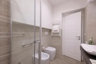 a bathroom with a toilet and a sink at St. Peter Fortytwo in Rome