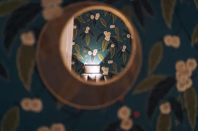a mirror with a reflection of a person in a room at Mi Hotel Home in Rome