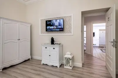 a hotel room with a large bed and a television at Charme & Chic Luxury in Rome