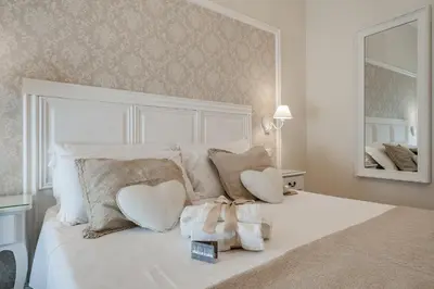 a bedroom with a bed with a stuffed animal on it at Charme & Chic Luxury in Rome