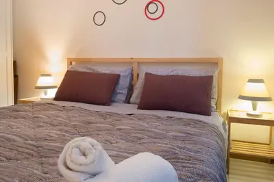 a bedroom with a bed with a towel on it at Casa Gaby in Rome
