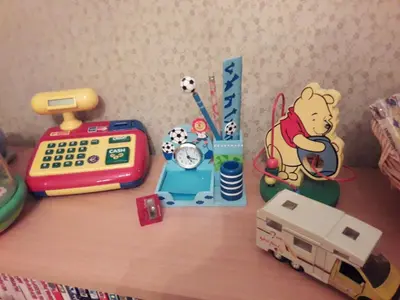 a table with a toy train and a toy calculator at The Queen's Coffer Rome in Rome