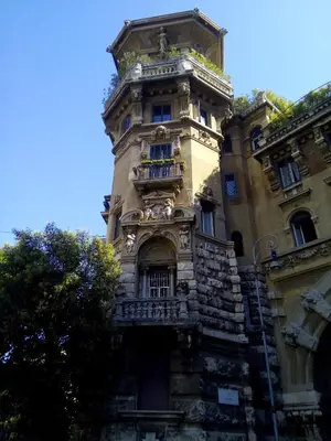 an old building with a tower on top of it at The Queen's Coffer Rome in Rome