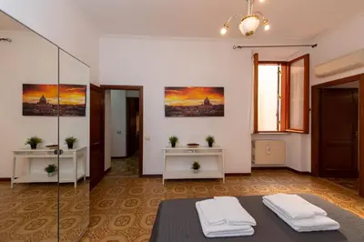 a room with two tables and two mirrors at Domus Candia in Rome