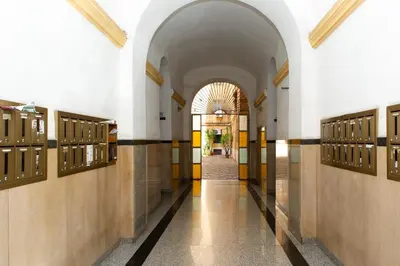 a hallway in a building with an archway at Domus Candia in Rome