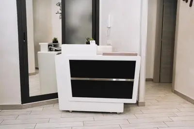 a white counter in a room with a mirror at 47 Steps in Rome