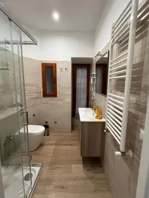 a bathroom with a tub and a sink and a shower at Ottaviano Lodge in Rome
