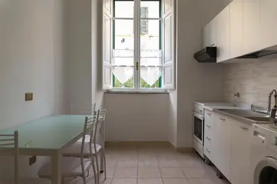 a kitchen with a table and a window at Marbel - Casa vacanze in Rome