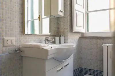 a bathroom with a sink and a mirror at Marbel - Casa vacanze in Rome