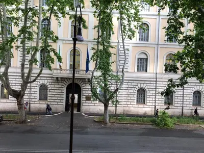 a building with a street light in front of it at Termini Palace Guesthouse in Rome