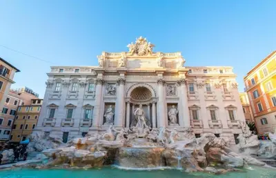 a building with a fountain in front of it at Termini Palace Guesthouse in Rome