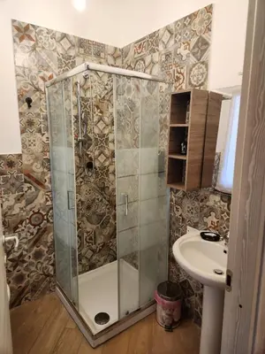 a bathroom with a shower and a sink at Le terrazze di Alberto in Rome