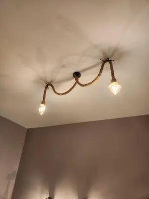 three lights on the ceiling of a room at Le terrazze di Alberto in Rome