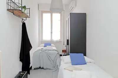 a white room with a bed and a basketball hoop at Triumph Apartment in Rome