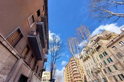 a city street with buildings and a blue sky at Triumph Apartment in Rome