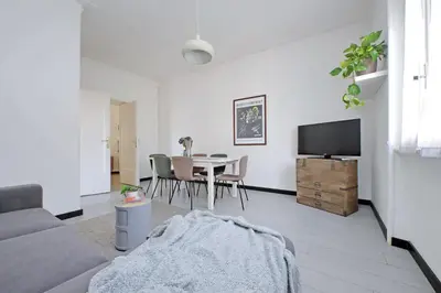 a living room with a table and a tv at Triumph Apartment in Rome