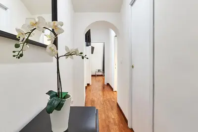 a bed with towels and pillows on it at Art House Centro Storico Apartment in Rome