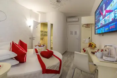 a bedroom with a bed with a red heart on it at Ripetta Luxury Del Corso in Rome