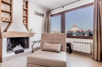 a living room with a chair and a fireplace at My San Pietro Home, Vaticano in Rome